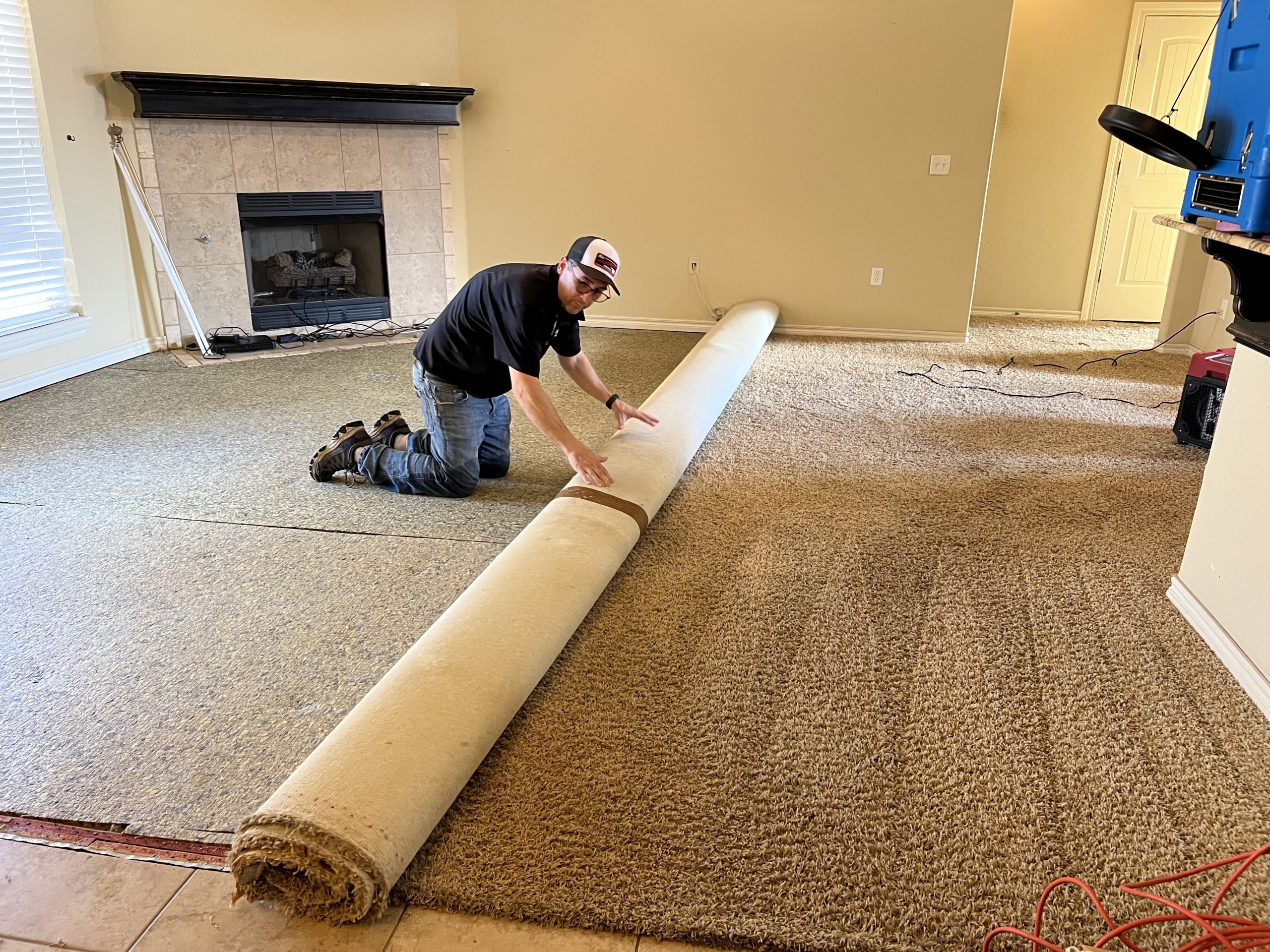 Wet carpet pad removal after an appliance water leak in Edmond Oklahoma